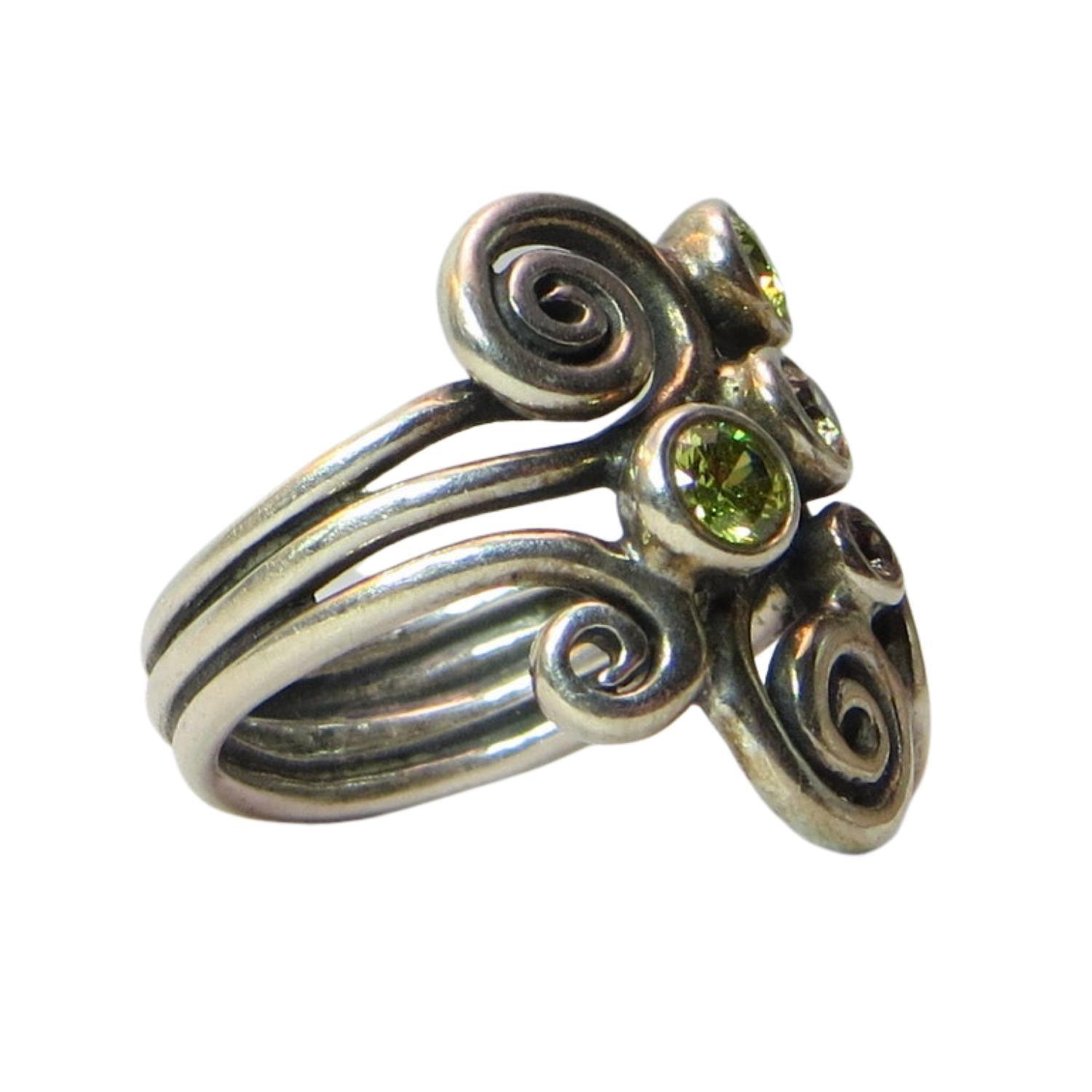 Pandora 190203CZP AUTUMN WIND Sterling Silver and CZ Ring.  Clear and green faceted CZs sit atop swirls of sterling.